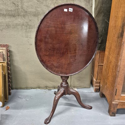 Lot 456 - A 19th century mahogany tilt top tripod table,...