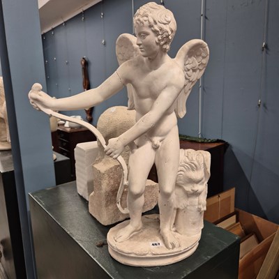 Lot 467 - A plaster figure of Cupid stretching his bow,...