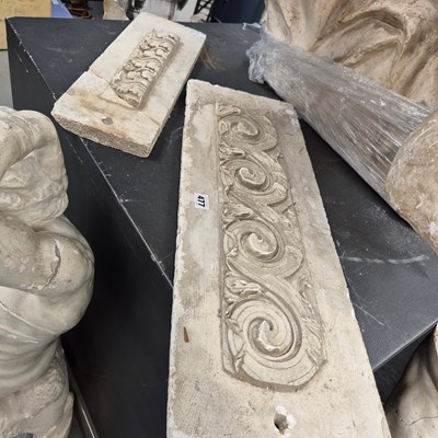 Lot 477 - Two composition panels, one cast in relief...