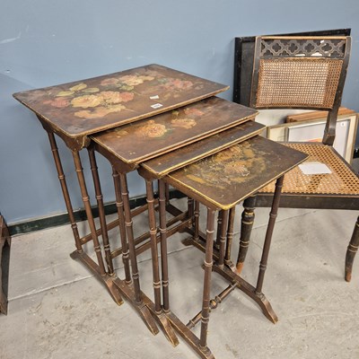 Lot 484 - A nest of four lacquer tables painted with...