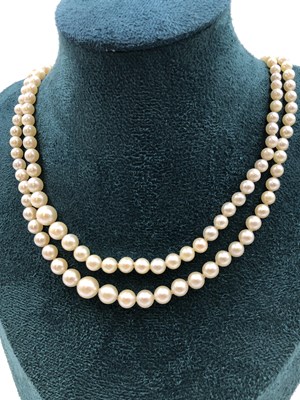 Lot 26 - An antique double strand of graduated cultured...