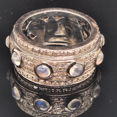 Lot 27 - A moonstone and diamond full eternity band...