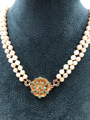 Lot 30 - A vintage two-row graduated pearl necklace...