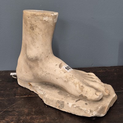 Lot 502 - A plaster cast baby's head, together with...