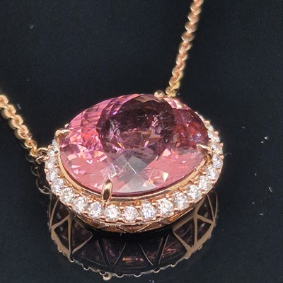 Lot 36 - A tourmaline and diamond rose gold pendant....