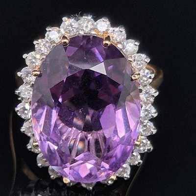 Lot 37 - An 18ct hallmarked gold, amethyst and diamond...