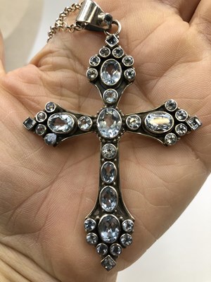 Lot 38 - A large gem set ornate cross pendant and chain....
