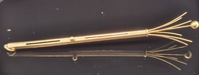 Lot 41 - An 18ct hallmarked gold retractable swizzle...