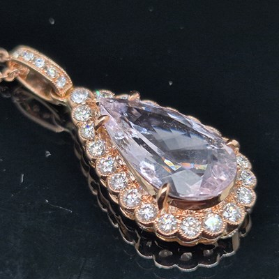 Lot 53 - A morganite and diamond pendant. The...