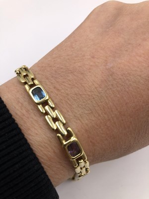Lot 59 - A multi gem set contemporary bracelet. Stamped...