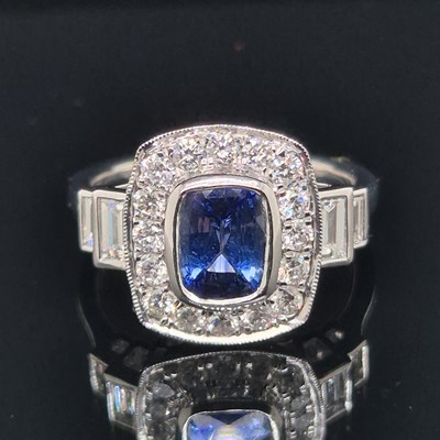 Lot 69 - A hallmarked platinum Art Deco style sapphire...