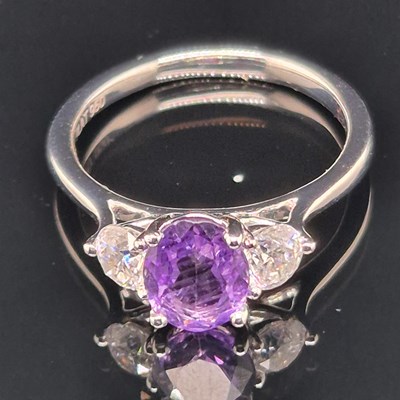 Lot 70 - A platinum hallmarked purple sapphire and...