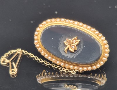 Lot 76 - An antique seed pearl, diamond and black...