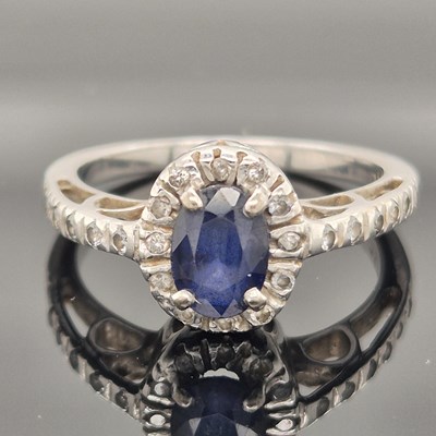 Lot 91 - A vintage sapphire and diamond cluster ring....