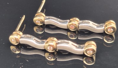 Lot 94 - A pair of gemset yellow and white gold drop...