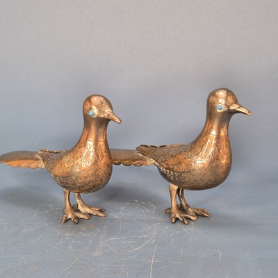 Lot 560 - A pair of antique Indian silvered copper...