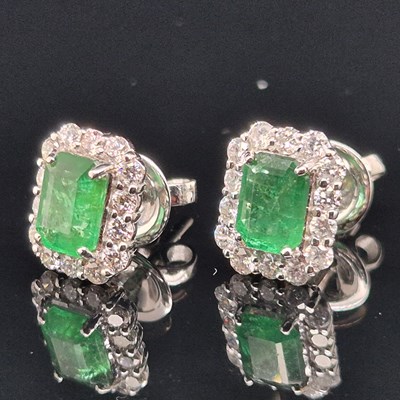 Lot 97 - A pair of emerald and diamond rectangular stud...
