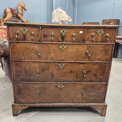 Lot 508 - An 18th century oak chest of three short...