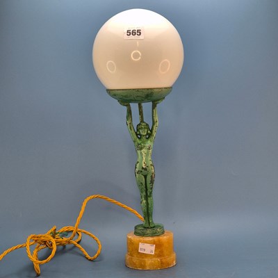 Lot 565 - An Art Deco table lamp, the milk glass...
