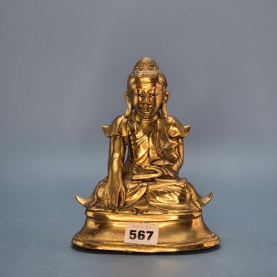 Lot 567 - A polished bronze figure of the Buddha seated...