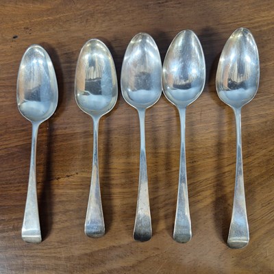 Lot 571 - Five various George III silver table spoons,...