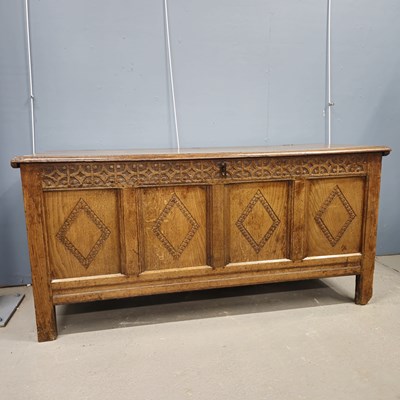 Lot 588 - An 18th century oak coffer with the four front...