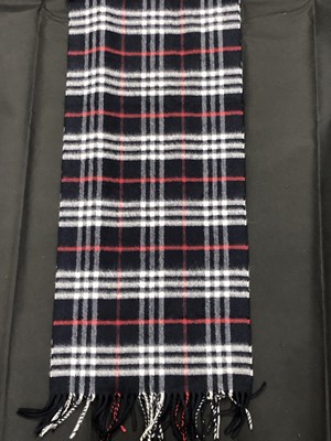 Lot 1103 - A Burberry London 100% cashmere navy scarf
