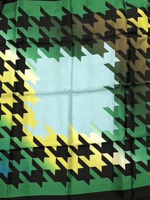 Lot 1123 - Three Coccinelle silk scarves. One green and...