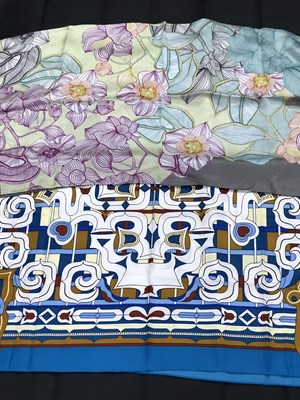 Lot 1124 - Two Coccinelle scarves.  One grey silk floral...