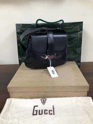 Lot 1131 - A navy vintage Gucci leather shoulder bag with...