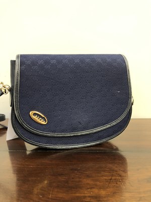 Lot 1133 - A vintage Gucci Cursive logo Microguccissima...