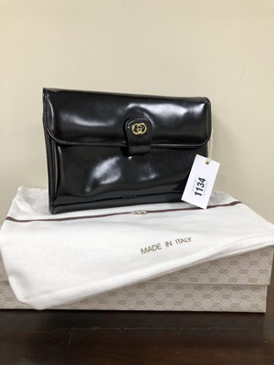 Lot 1134 - A vintage Gucci black bag .22x1 cm (approx)...