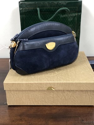 Lot 1137 - A vintage Gucci navy suede and leather clutch...