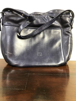 Lot 1135 - A vintage Loewe Flamenco Knot navy leather bag.