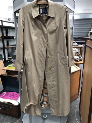 Lot 1150 - A lady's Burberry trench coat. size 14 extra long