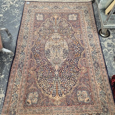 Lot 625 - An oriental rug of classic Persian design 223...