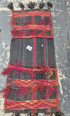 Lot 628 - A tribal flatweave saddle bag.