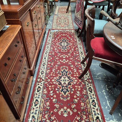 Lot 629 - A machine made runner of Persian design. 250 x...