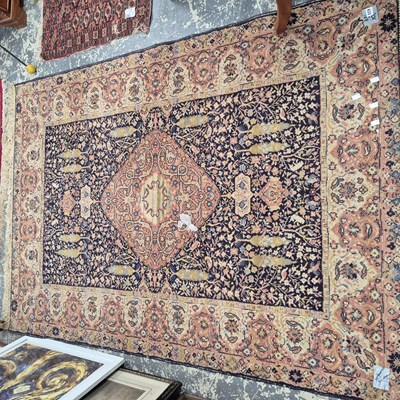 Lot 632 - A machine made rug of Persian design 206 x 148 cm
