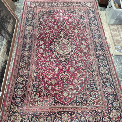 Lot 657 - A Persian Kashan rug. 217 x 137 cm.