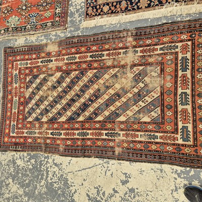 Lot 658 - An antique caucasian tribal rug. 225 x 115 cm.
