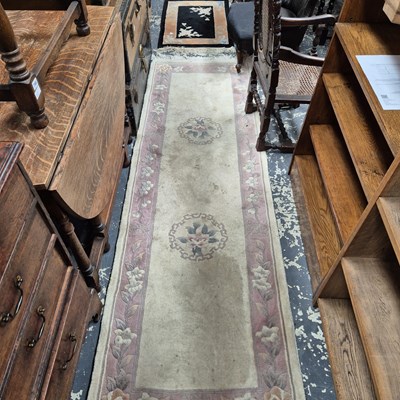 Lot 644 - A Chinese runner 250 x 80 cm, together with a...