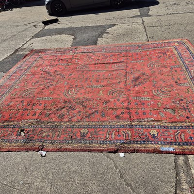 Lot 647 - An antique Turkish Oushak carpet retailed by...