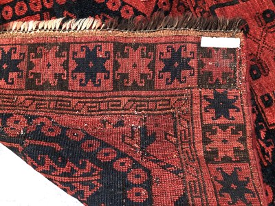 Lot 667 - An antique Afghan Bokhara rug. 300 x 214 cm.