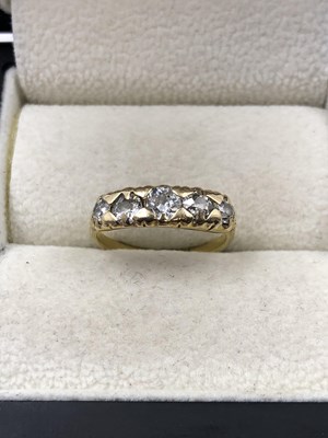 Lot 1043 - A vintage five-stone graduated diamond ring....