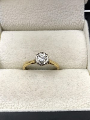Lot 1048 - An 18ct hallmarked gold diamond solitaire ring....
