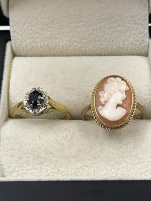 Lot 1049 - An 18ct hallmarked gold sapphire and diamond...