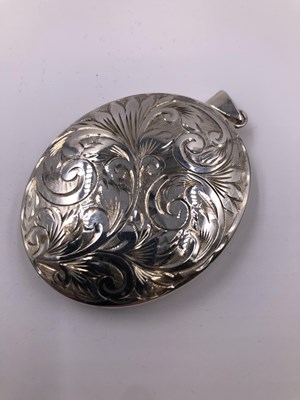 Lot 1005 - A large hallmarked silver engraved portrait...