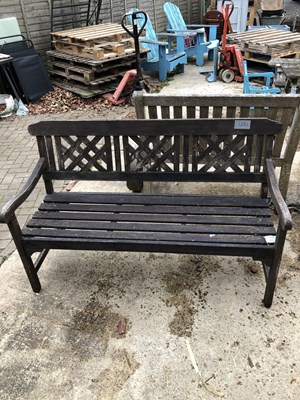 Lot 1251 - A Dark stained hardwood garden bench with...