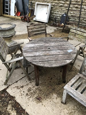 Lot 1253 - A small patio set with folding chairs.